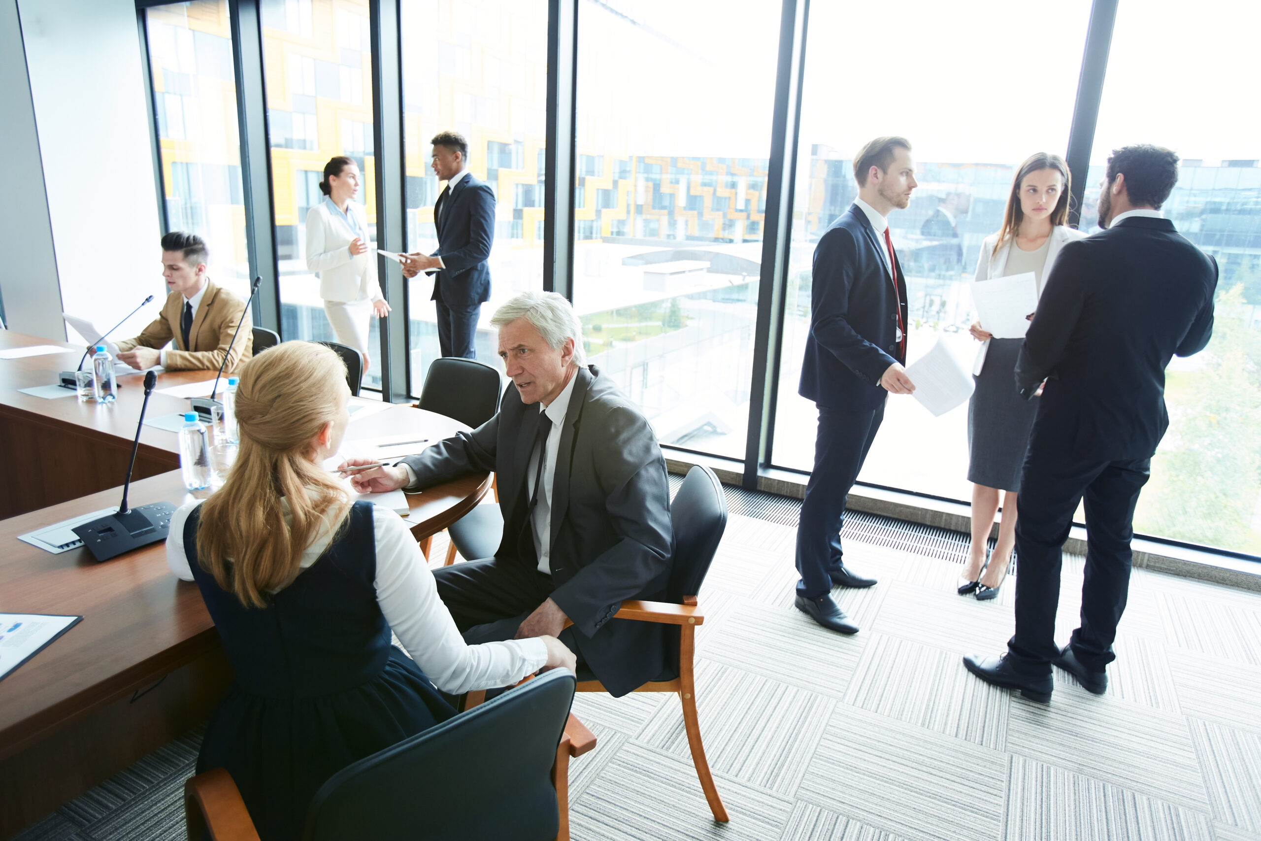 Banking professionals reviewing governance and compliance documentation